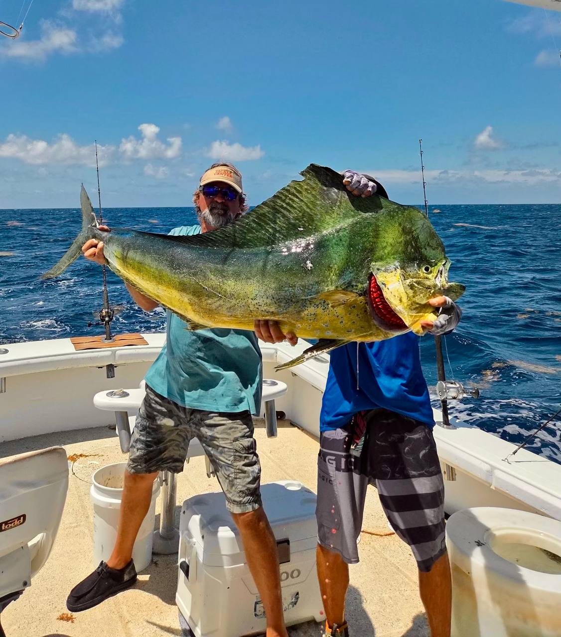 Clayton with a 60+ lb bull mahi caught aboard the Coral Sea